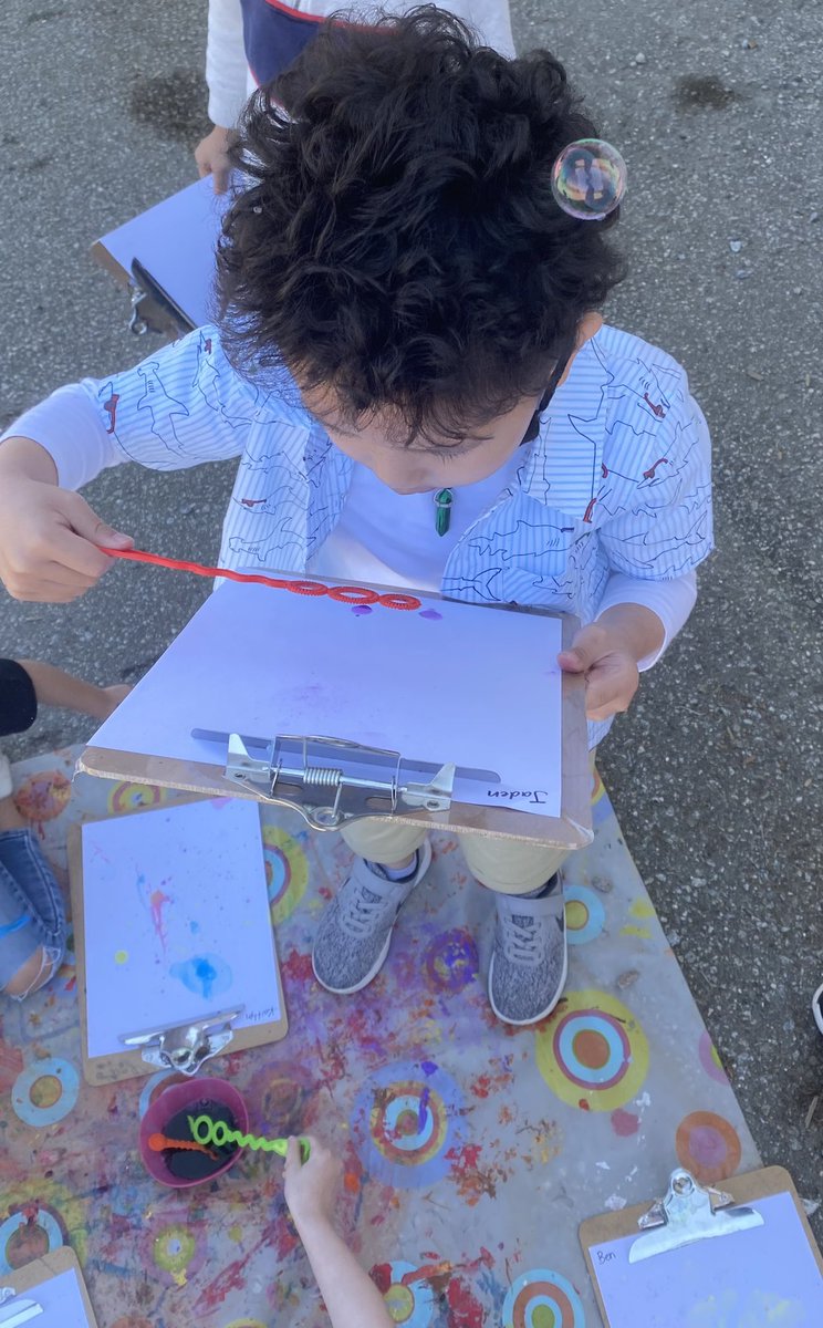 brentwoodSD41's tweet photo. Coloured bubble solution + wands + air (and wind 🤣) = fun outdoor Science and Art exploration by the Kindergarten children in Division 19. #sd41 @jteach22 https://t.co/CWgcHixmqQ