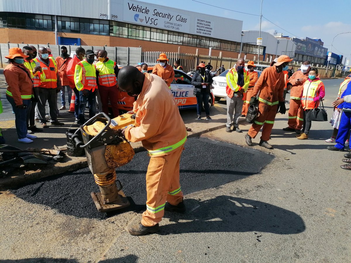 CoJTransport's tweet photo. #SmartMobilityWeekends. Eloff street Ext road patching. @CityofJoburgZA #WeServeJoburg #JoburgServices #TransportingJoburg https://t.co/hyZH27oLLg