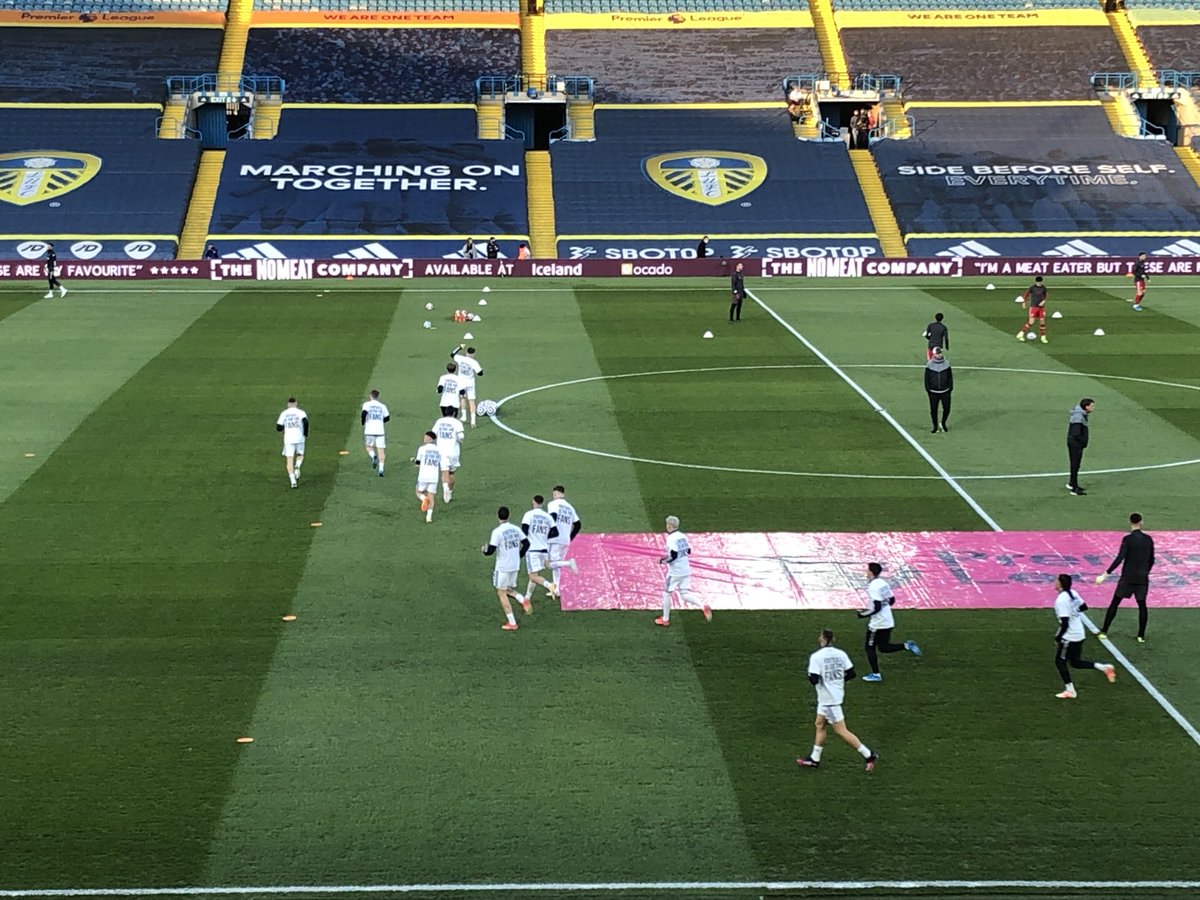 #lufc players warming up in T-shirts that carry the message: “Earn it on the pitch” and “Football is for the fans”. #LEELIV #EuropeanSuperLeague