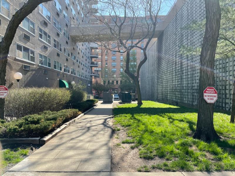 Example of what "linear park" at Hoboken's North End Redevelopment Area could be. This open space between Marine View Towers &amp; Municipal Parking Garage is not viewed or used by anyone as a public park. Note the back door &amp; garbage bins. #hoboken #urbandesign #publicspace