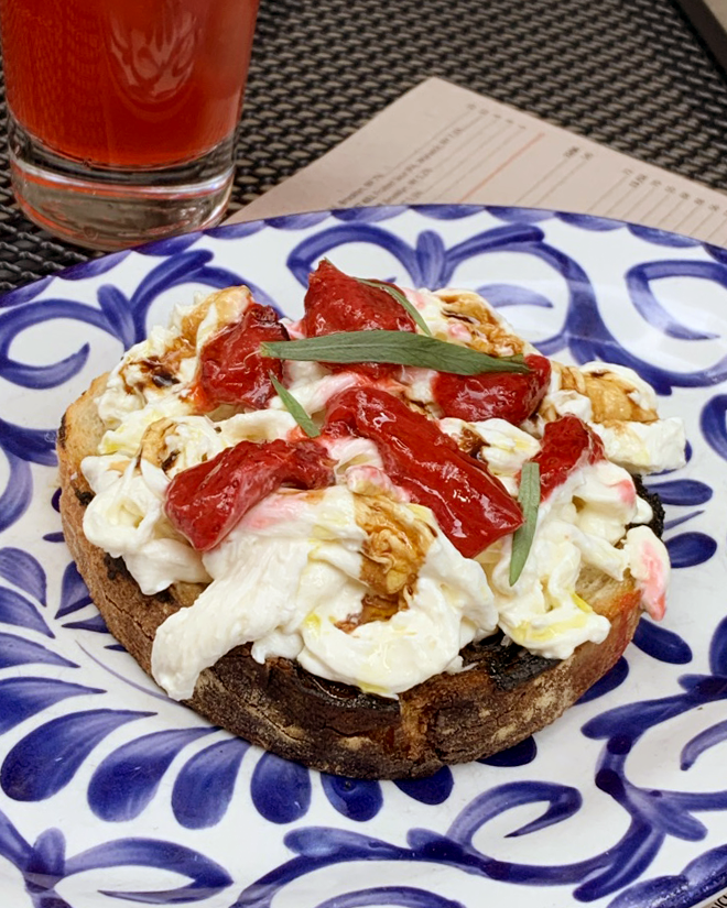 Zooming in on one of our favorite antipasti: Stracciatella Crostino topped with wood roasted strawberries and aged balsamico.