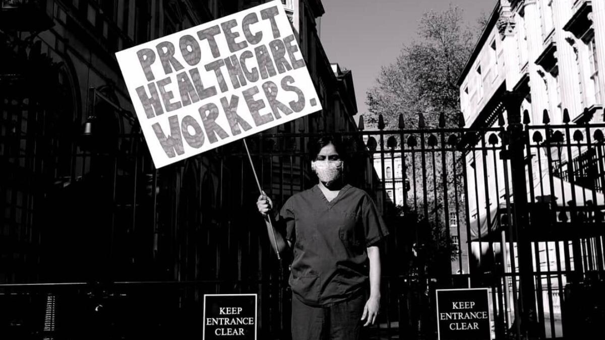 I walked down Whitehall, dressed in my hospital scrubs.I stopped outside the gates of Downing Street, where I held up a sign for one hour:“Protect Healthcare Workers”