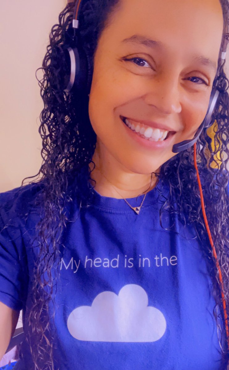 Noelle wearing a my head is in the cloud tee.