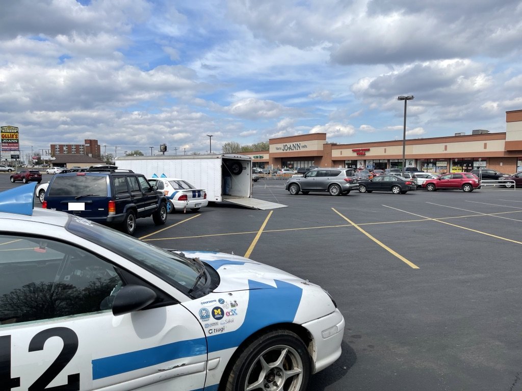 drchuck's tweet photo. Our un-heroic @SakaiCar fix @24hoursoflemons - We lose a throw-out bearing on lap 20.  Tow broken car Pittsburgh->Toledo, tow spare car Lansing->Toledo, make the swap in Maumee @HarborFreight parking lot while fixing a blown trailer tire with a jack purchased @HarborFreight https://t.co/yilWc6ktgU