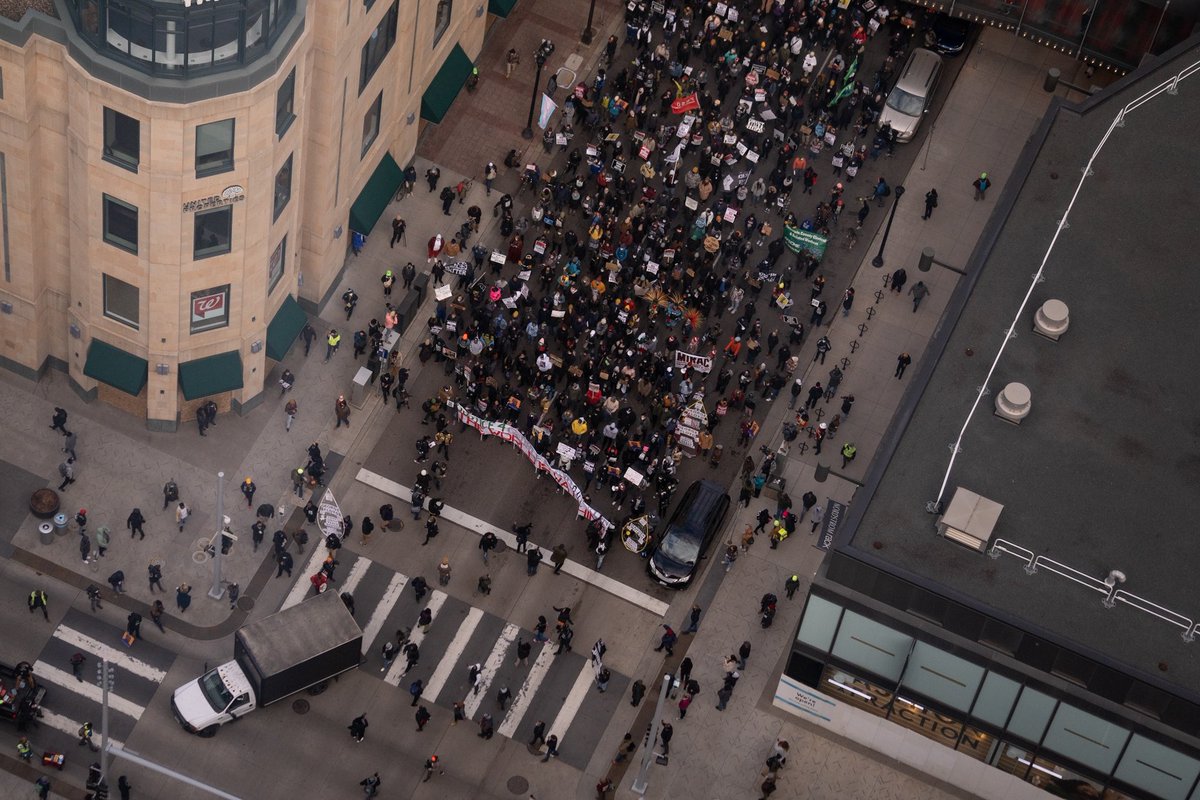 daviss's tweet photo. Protesters march through downtown Minneapolis as the Derek Chauvin murder trial is in the juries hands 329 days after George Floyd’s death. #ChauvinTrial https://t.co/5PIqJUK12J
