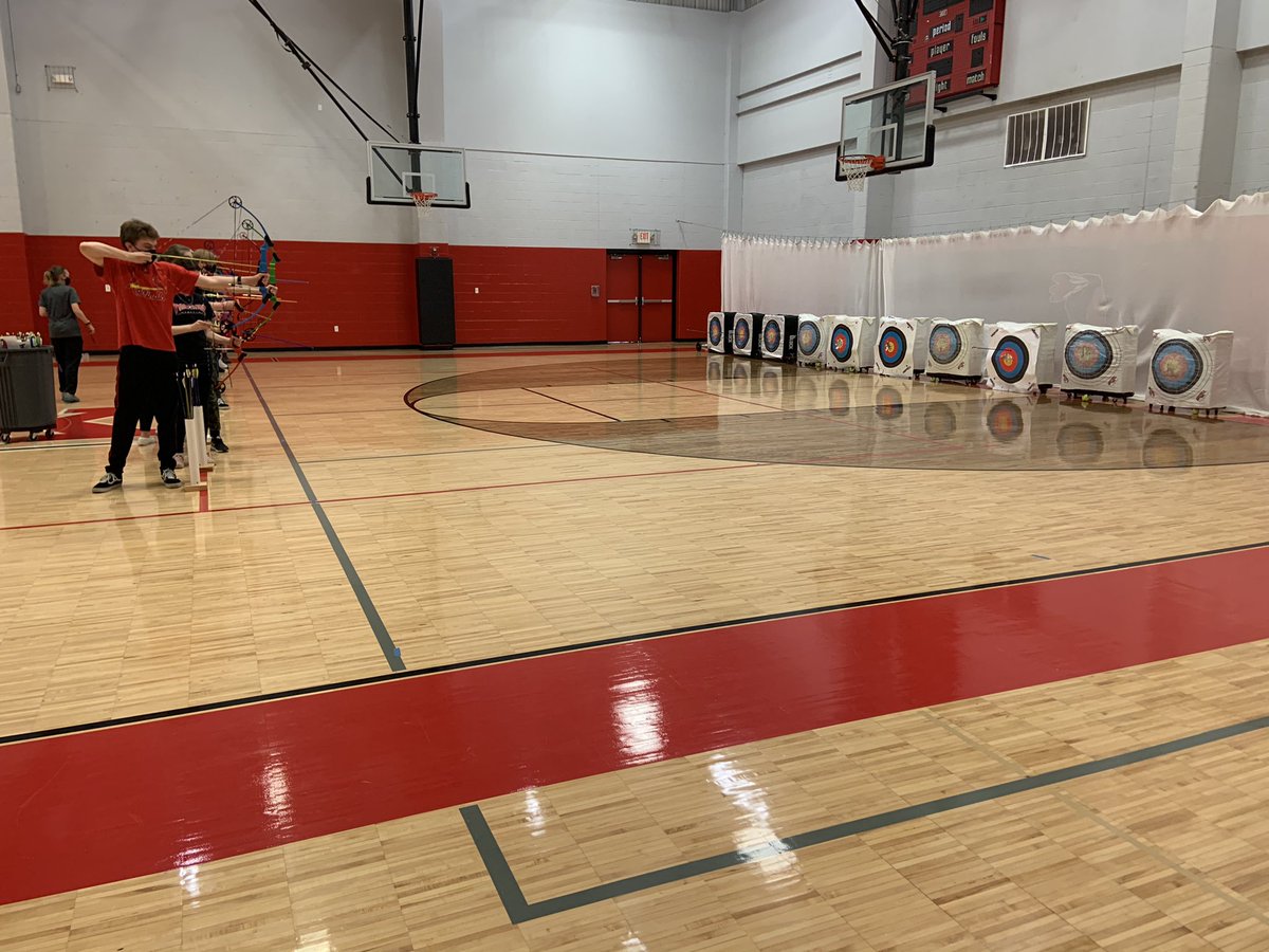 CoachDirden's tweet photo. Our student teacher Ms. Lewis teaching our students how to do Archery in PE classes! We are always up for learning something new. 💪🏼#FoxWarriorWay https://t.co/1jZvKbvIap