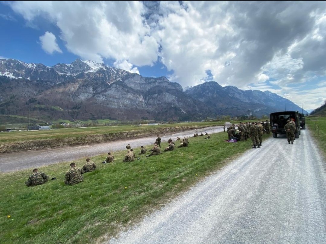 f29: some soldiers having a lunch break at a nice place