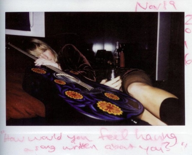 19 november 2016: this polaroid of taylor with her guitar, captioned “how would you feel having a song written about you?” was taken.it's later included in one of the reputation magazines and credited to frosty crew photography aka joe.