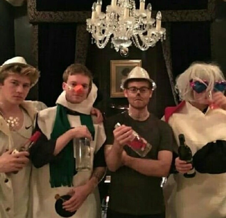 31 december 2016: taylor and joe celebrate NYE together and throw a party at her london rental.joe's friends post photos from the party, and the theme seemingly had something to do with snowman costumes and pink/purple wigs??