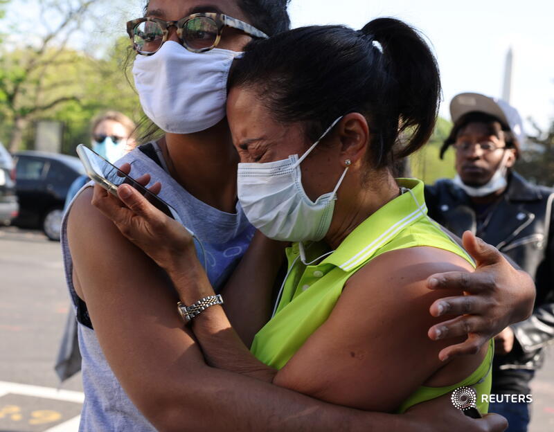 People embrace at Black Lives Matter Plaza in Washington, and more photos of joy and tears across the U.S. after the Chauvin verdict:  https://reut.rs/3dwMNf8    @evelynpix