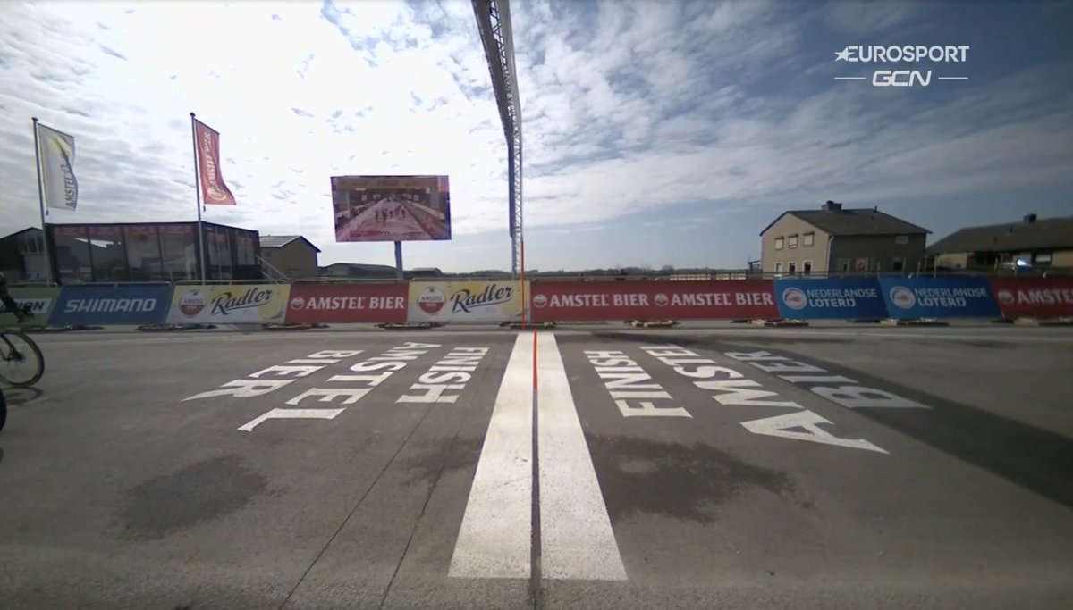 As the finish line didn't fully cover the road, we drew the finish line trough to the barriers and use it to roughly estimate the gap between the finish line and the photo finish The finish is 96 pixels modelled at the barrier, the gap between the two lines is 71 pixels.