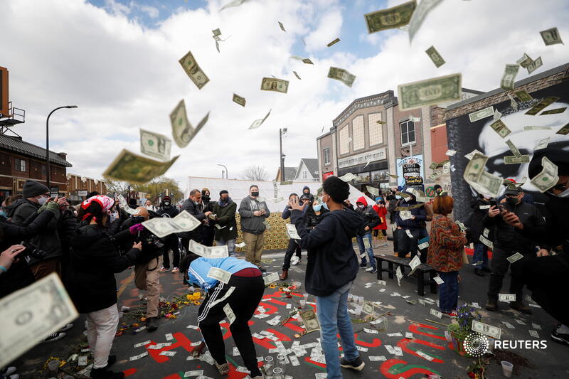 People throw dollar bills in the air in celebration at George Floyd Square, a rallying point for racial justice protests, after the verdict in Minneapolis. More images:  https://reut.rs/3dwMNf8    @OctavioJones