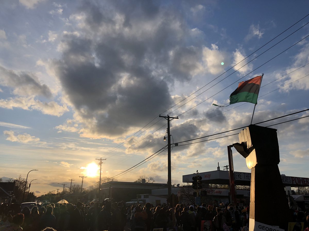 OmarJimenez's tweet photo. The sun sets on the intersection where George Floyd took his last breaths and on a day people have been waiting on for almost a year. #GeorgeFloyd #DerekChauvin https://t.co/mPos11GUzc