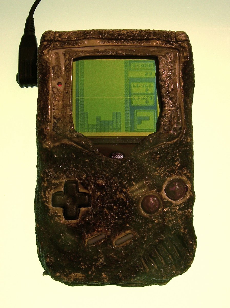 But in every other way his creation was an incredible success. In comparison to the jet blacks and sleek looks of rival machines it was soft, rounded, kawaii. It was ergonomic, practically begging to be played. And indestructible. One even survived a Gulf War bombing. (5/