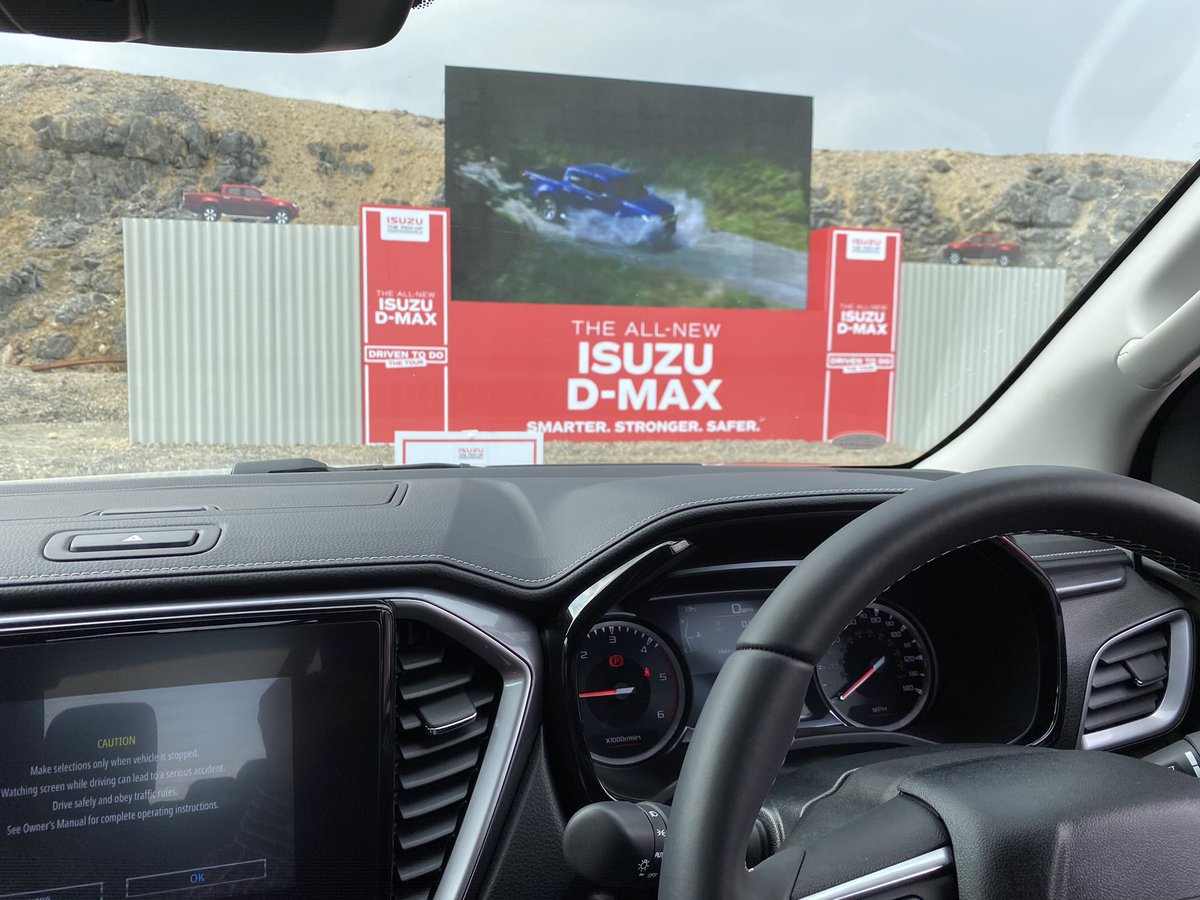 MartinWard_Cars's tweet photo. In a huge quarry near Buxton for the @Isuzuuk #NewDMax launch.. we are having a press presentation and product briefing, sat in our pick-ups watching it on a Big-Screen.. Isuzu have kindly supplied a bag of sweets and popcorn for the duration of the show... https://t.co/yXAjAzqrMS