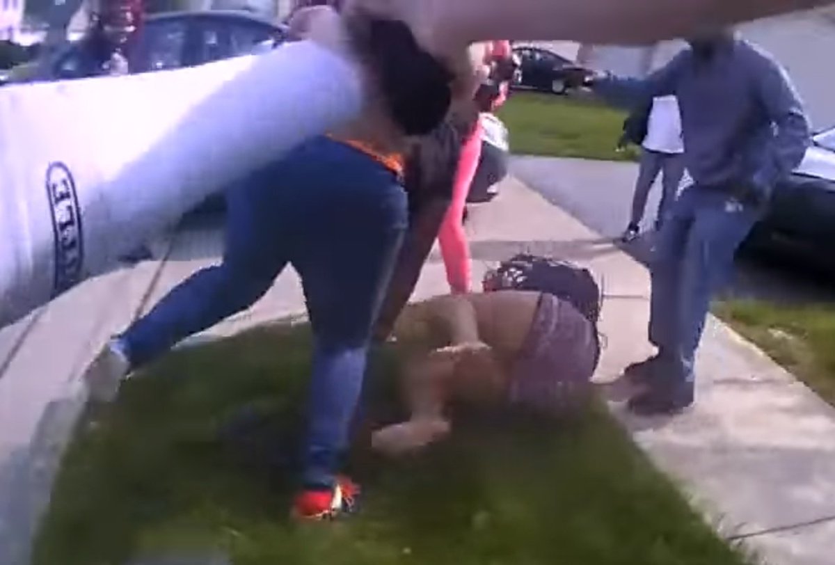 She was close enough to be tackled or tased before getting close to the girl in pink, but the cop opted for lethal force instead. Her back is to the cop, and he could've have easily tackled her, but he was too busy aiming his firearm to shoot.