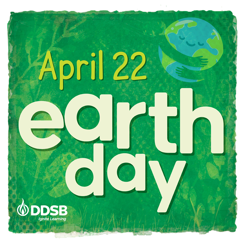 Words "earth day" displayed over a green background with an image of the world displayed in the top right corner seemingly being hugged with a smile.