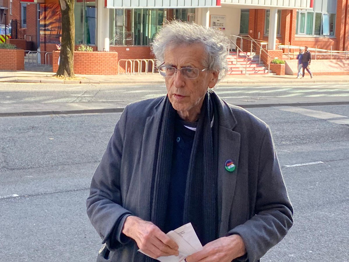 Piers Corbyn, carrying a Lidl bag full of documents, has entered court. He's alleged to have taken part in an illegal gathering on College Green last November