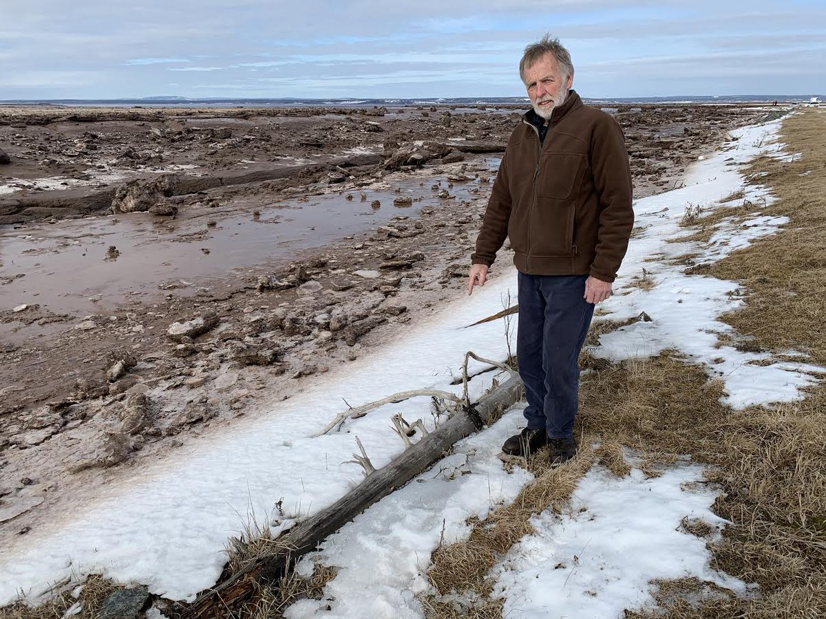 infomorning's tweet image. John Atkinson on his farmland just west of Amherst, at the mouth of where the LaPlanche River and the Missaguash River meet before they empty out into the Cumberland Basin. In the past 70 years, the sea level there has risen more than a third of a metre.