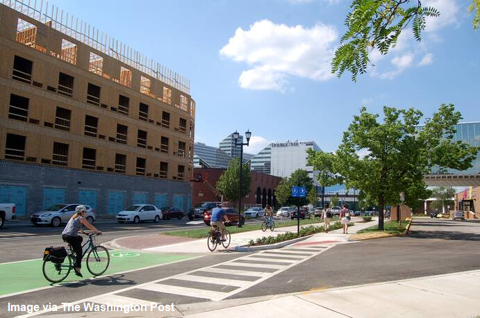 One road reconfiguration involved removing one vehicle lane, creating a two-way road, adding sidewalks and a bike lane.  #GOPCThread