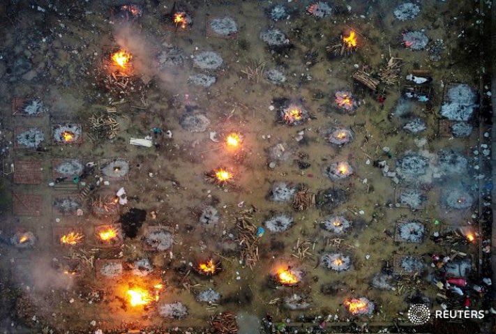 This image of funeral pyres in India are heartbreaking. COVID19 is ravaging the entire nation. The entire nation.  @ReutersIndia