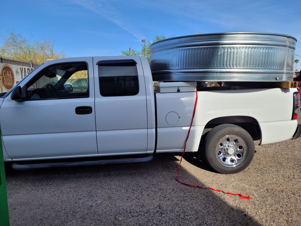 wendyduenez's tweet photo. Whitney bought herself a redneck swimming pool. This is a trendy thing right now but it’s NOT a new concept. This was how my dad cooled off after a long day of working on tractors. #stocktankpool #chevytruck @CALRanch https://t.co/28nYwXLRSG