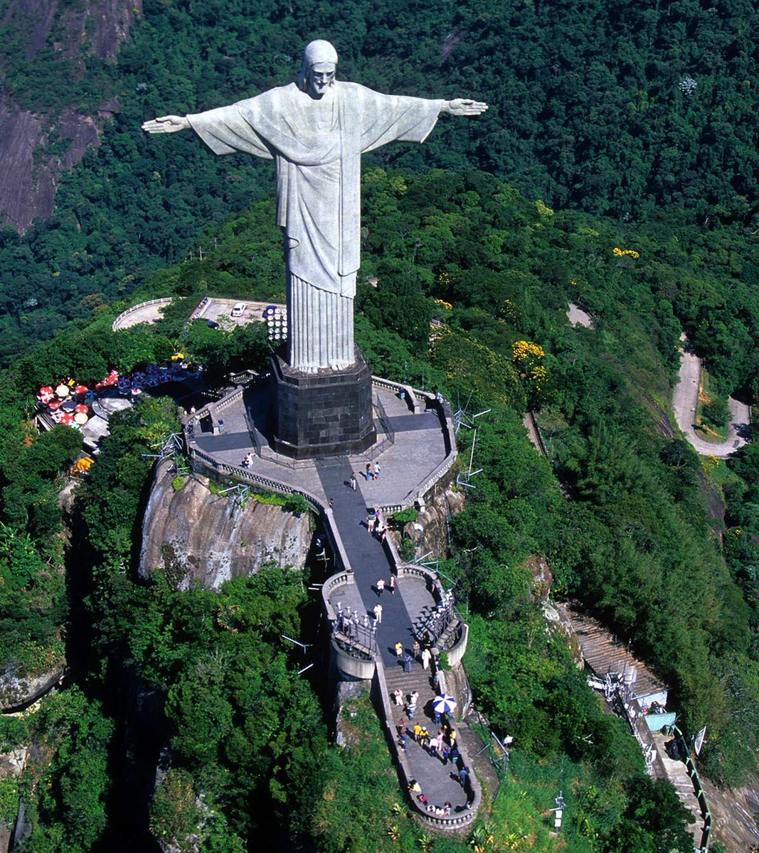 Hobi As Christ the Redeemer Statue, Rio de Janeiro: The Art Deco-style Christ the Redeemer statue has been looming over the Brazilians from upon Corcovado mountain nurturing them! Who nurtures BTS and ARMY more than Hobi? He lights us up with positivity!   #BTSARMY  @BTS_twt
