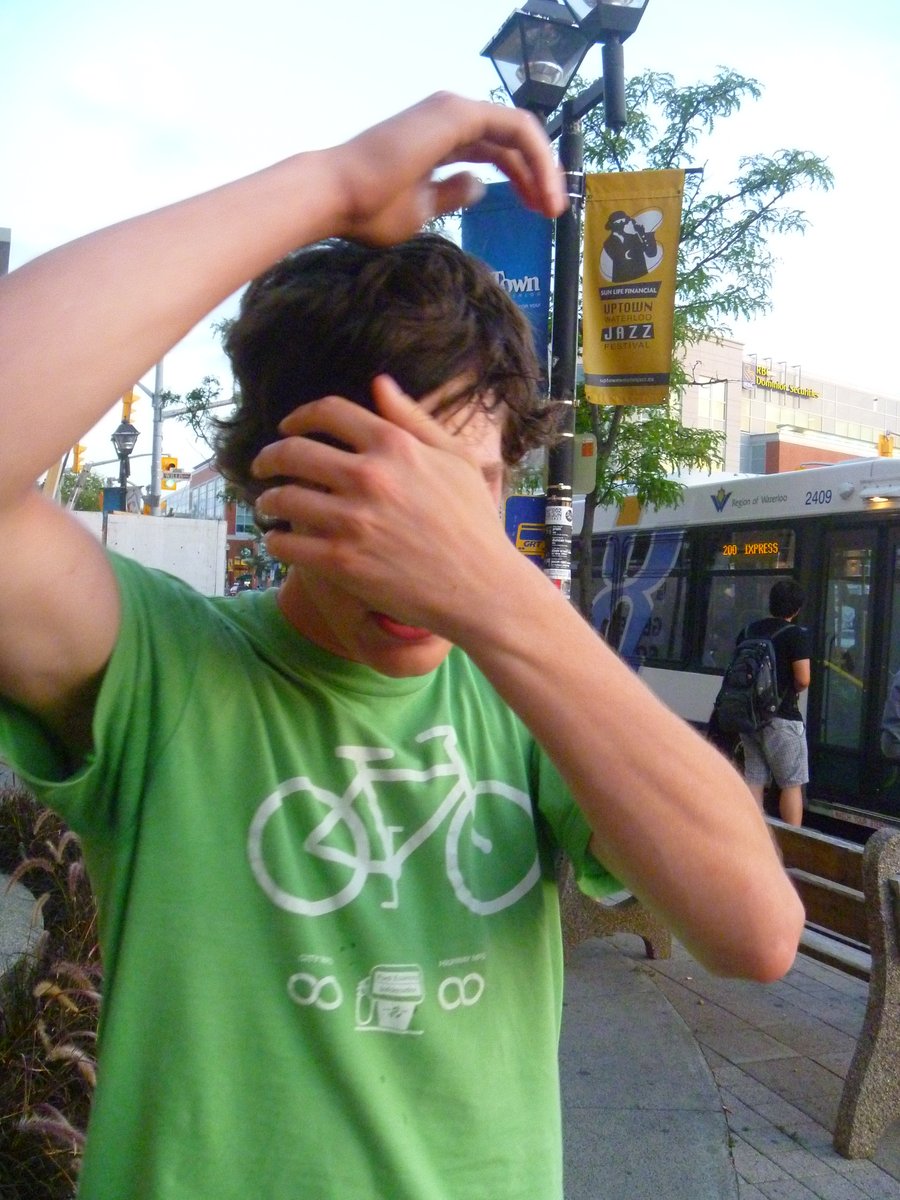 I rode from Waterloo to New Hamburg with my roommates one day. We rode our bikes to the strip malls on the edge of town to go dumpster diving. Here’s one of my roommates in a “bikes have infinity mileage” shirt. You can see where this is going.