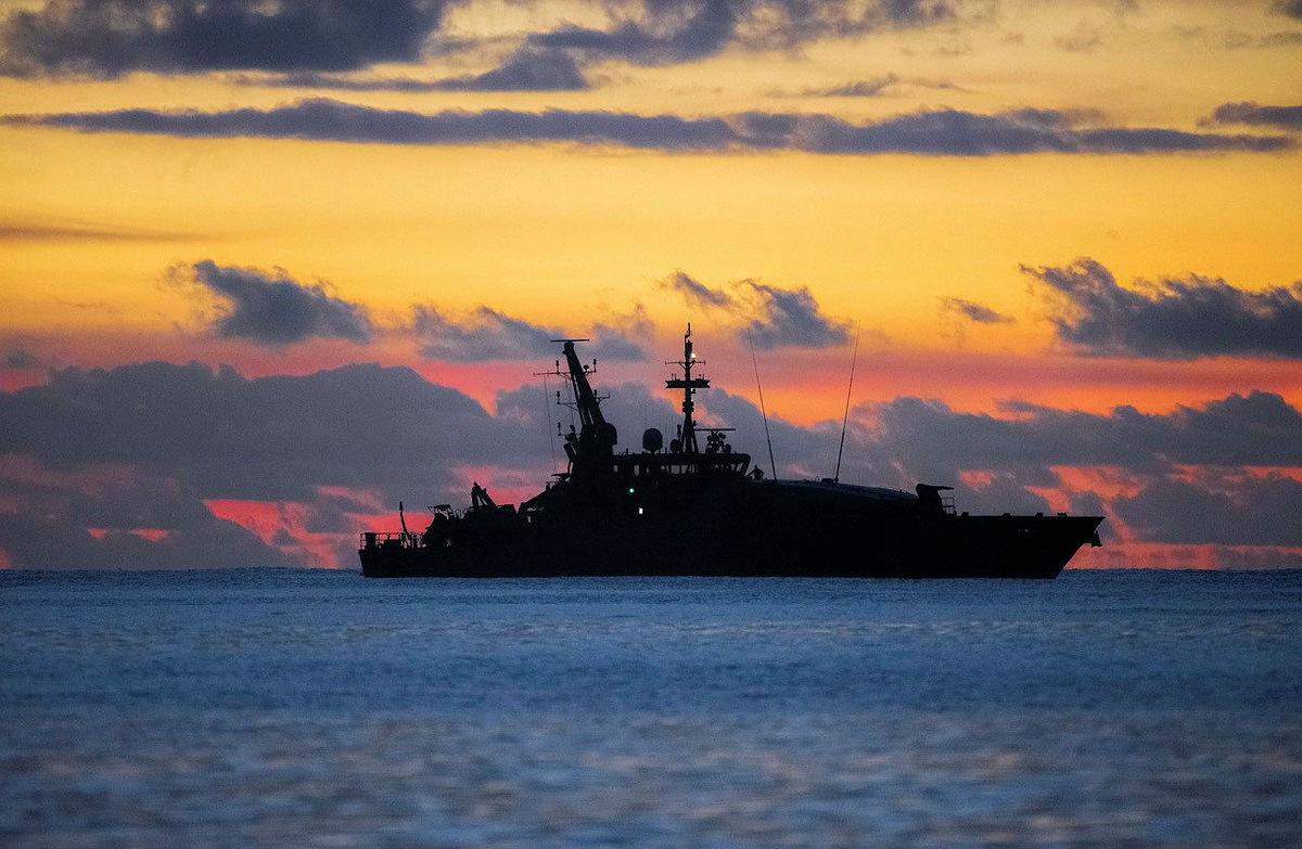 Australian_Navy's tweet photo. #AusNavy patrol boat #HMASLaunceston sails off the coast of Christmas Island while she conducts border protection as part of #OpResolute 🌅 #YourADF https://t.co/1AlD75fCqj
