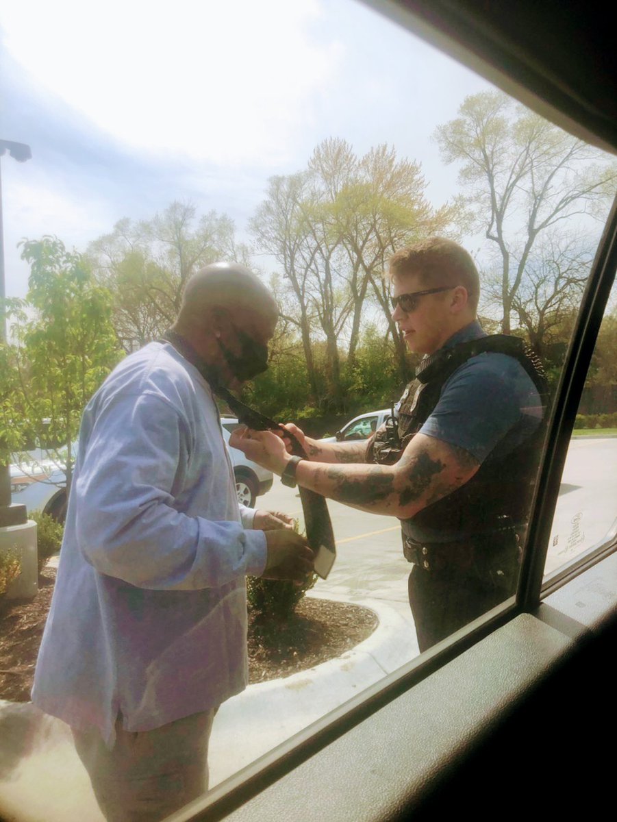 kcpolice's tweet image. East Patrol officers stopped at Quik Trip and got to chatting with this man. He was on his way to a funeral and couldn't remember how to tie a tie, so one of the officers gave him a refresher.