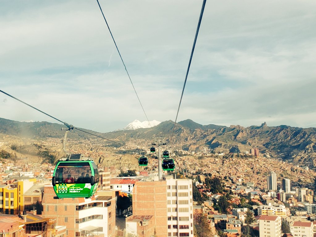 johanncb's tweet photo. I found this old (pre-covid era) picture of #LaPaz city on my camera roll. The mountain in the background is the #Illimani, which is, according to legends, the protector of the city. I added a yellow filter, because. https://t.co/AIZnrczvRt