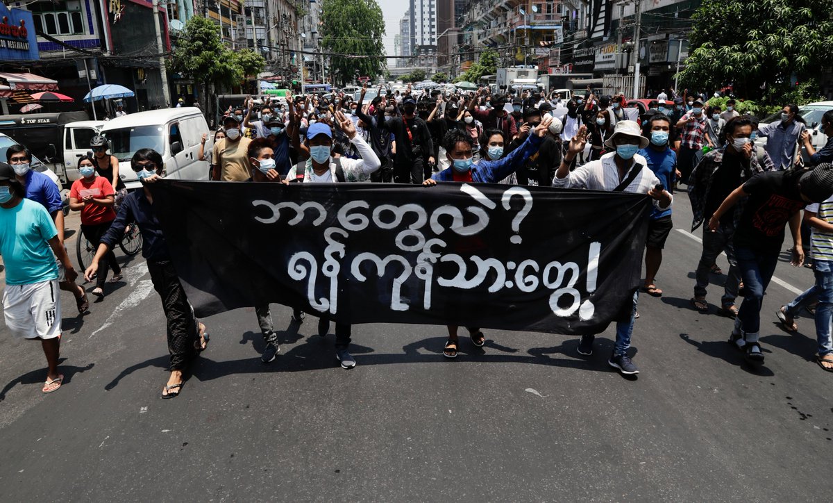 MizzimaNews's tweet photo. Protestors flash the three-finger salute as they march during a protest against the military coup in downtown Yangon today. According to the UN, nearly 3.5 million people in Myanmar may struggle to afford food in the coming months in the wake of the coup and financial crisis. EPA https://t.co/co6SIx4g4X