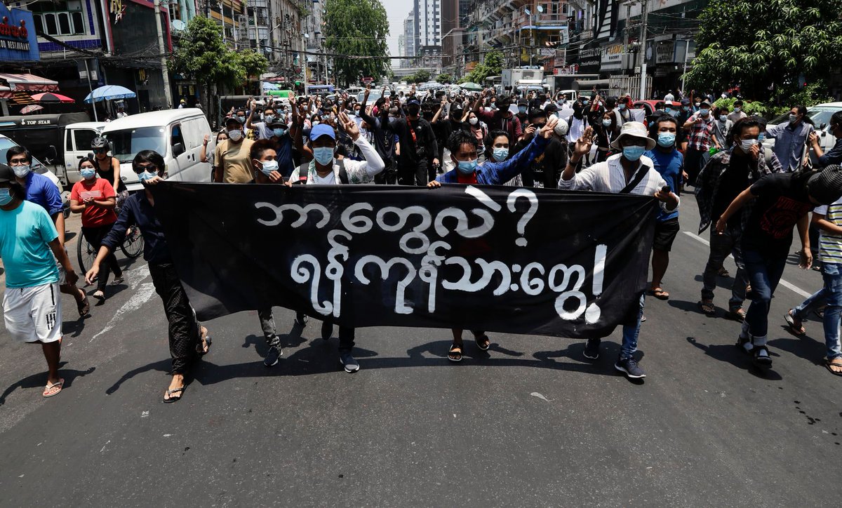 Myanmar_Now_Eng's tweet image. People marched in an anti-coup protest through downtown Yangon on Friday, the first in days through the heart of the city. Demonstrators were seen holding a banner that read, 'What is this? We are Yangon people’ as they rallied on Anawrahtar Road. (Photos- EPA)