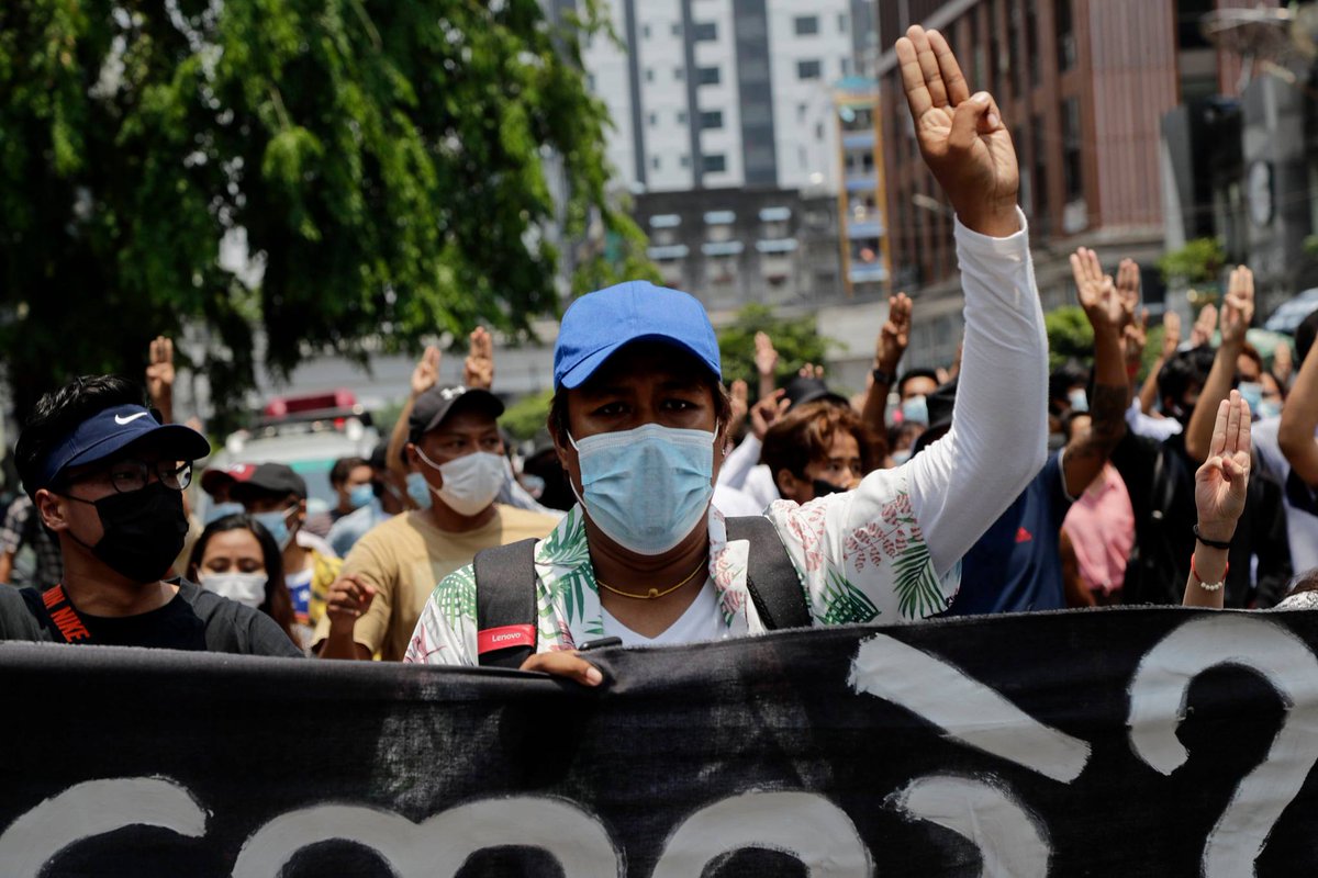 Myanmar_Now_Eng's tweet image. People marched in an anti-coup protest through downtown Yangon on Friday, the first in days through the heart of the city. Demonstrators were seen holding a banner that read, 'What is this? We are Yangon people’ as they rallied on Anawrahtar Road. (Photos- EPA)