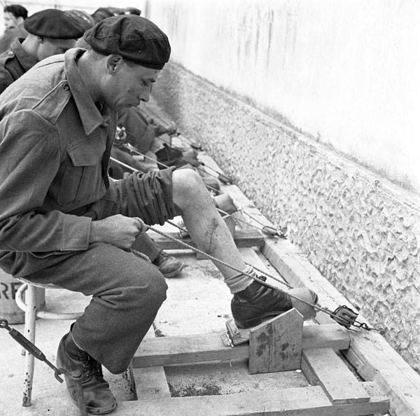 Sapper L.C. St. Denis of the 2nd Field Park Company, Royal Canadian Engineers (R.C.E.), exercising his wounded legs at No.1 Convalescent Depot, Royal Canadian Army Medical Corps (R.C.A.M.C.), Salerno, Italy, ca.1-2 May 1944.

amzn.to/2QVp4w4