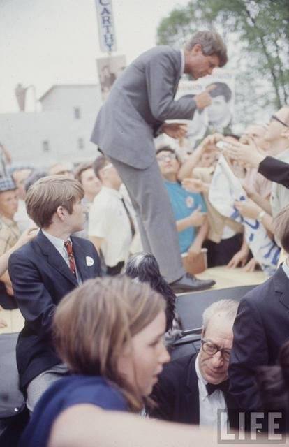 "At each place the motorcade would stop in the main street and Kennedy--who had risen to the tonneau of the convertible as his car approached town--would climb out onto the trunk and speak," Martin recalled.