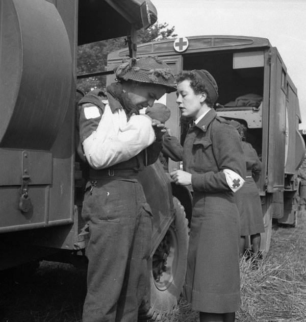 Pte. F. Madore with Nursing Sister M.F. Giles waiting for an air-evacuation from an R.C.A.F. Spitfire base, Normandy, France, 16 June 1944.

amzn.to/3erjTw7