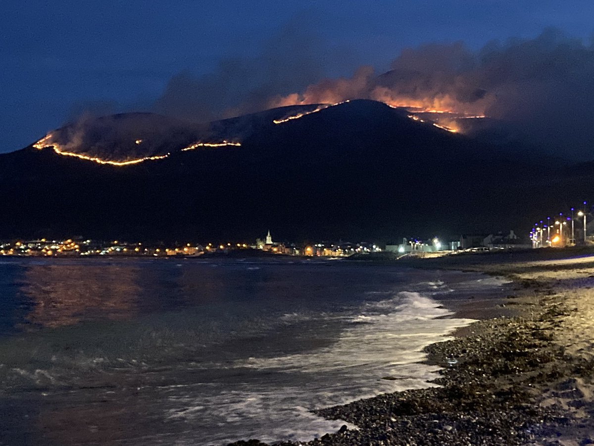 This picture gives a sense of the scale of the Mournes fire  This is the view from Newcastle tonight. Fires also raging on the other side of the slopes.