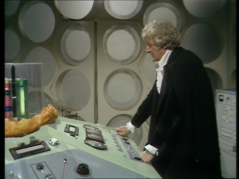 12/ Sharp oversaw the introduction of a new TARDIS console. The walls hadn't been seen since The War Games. The roundel left of the door had its Wheel in Space detail finally removed. The photo blow up walls were placed as a corridor outside the doors.