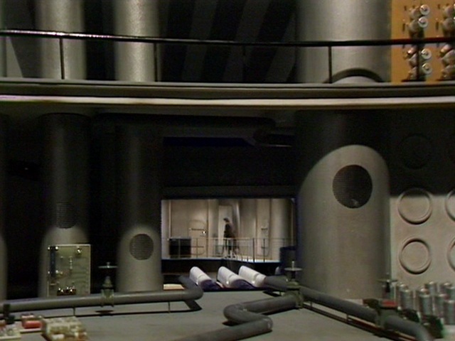 17/ The Ore processing deck where the TARDIS was moved to. Michael E. Briant used a foreground miniature to make the location look larger.The Hopper set was used at TV Centre and at Ealing film studios for the part 1 cliffhanger.