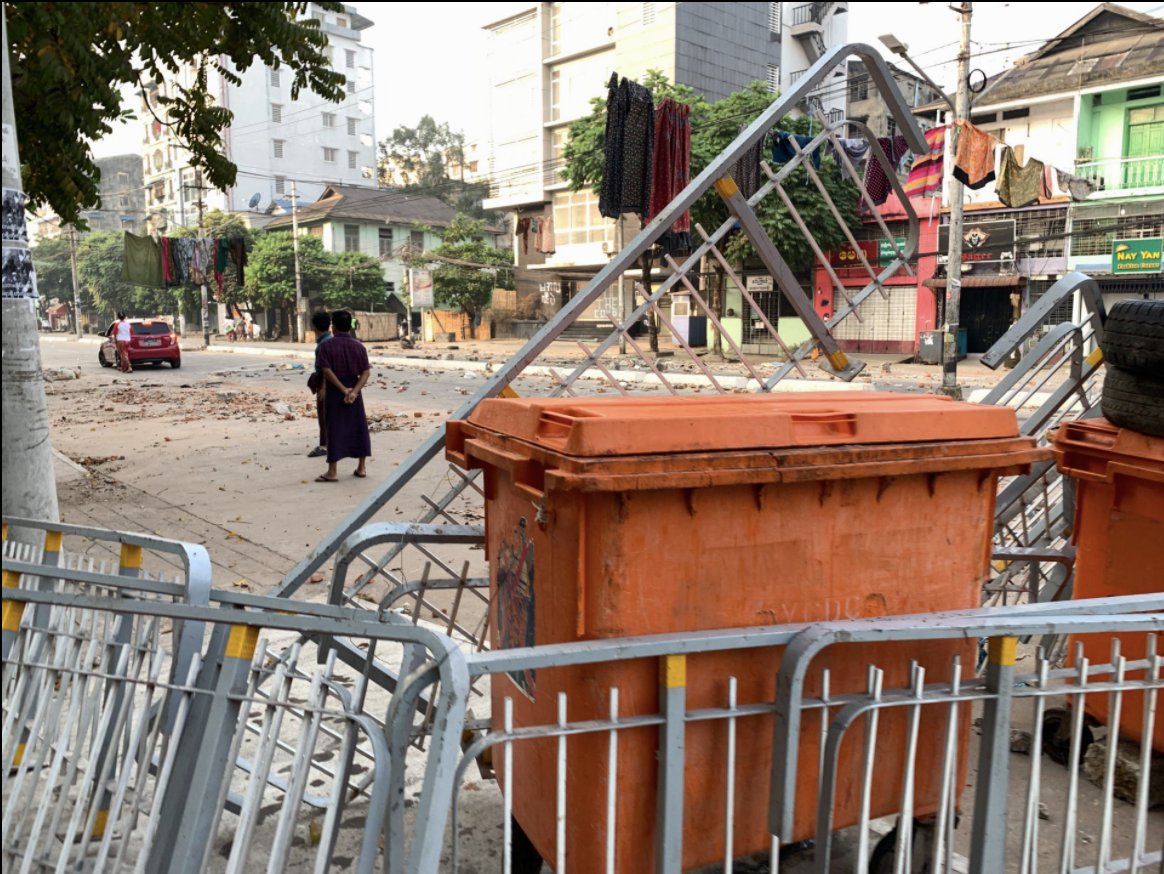 Barricades are the new architecture of Yangon. When the police bulldoze them away, they are built again. 5/
