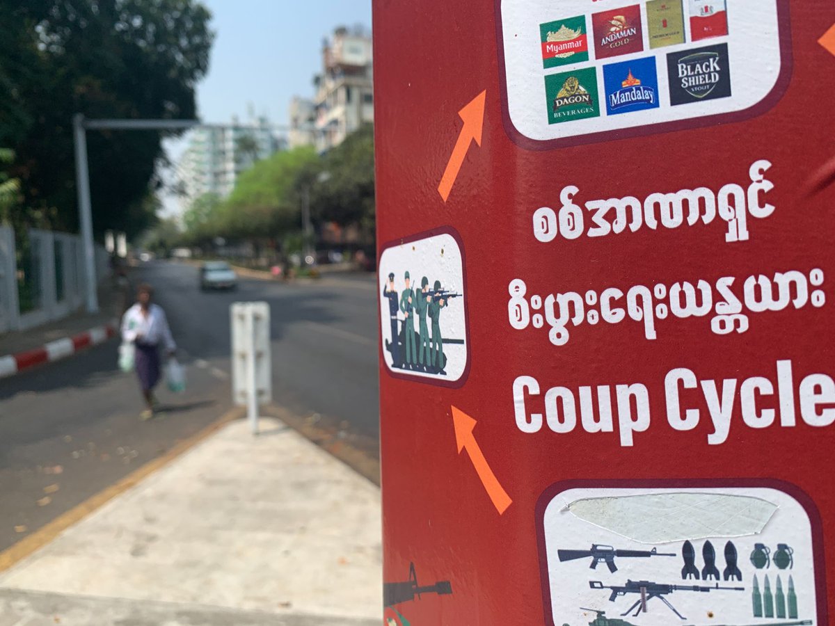 This protest placard maps the life cycle of Myanmar’s long military dictatorship: Economic interests funding oppression. The poster singles out Myanmar Brewery and Mandalay Brewery, companies co-owned by the army, for boycotts. 8/