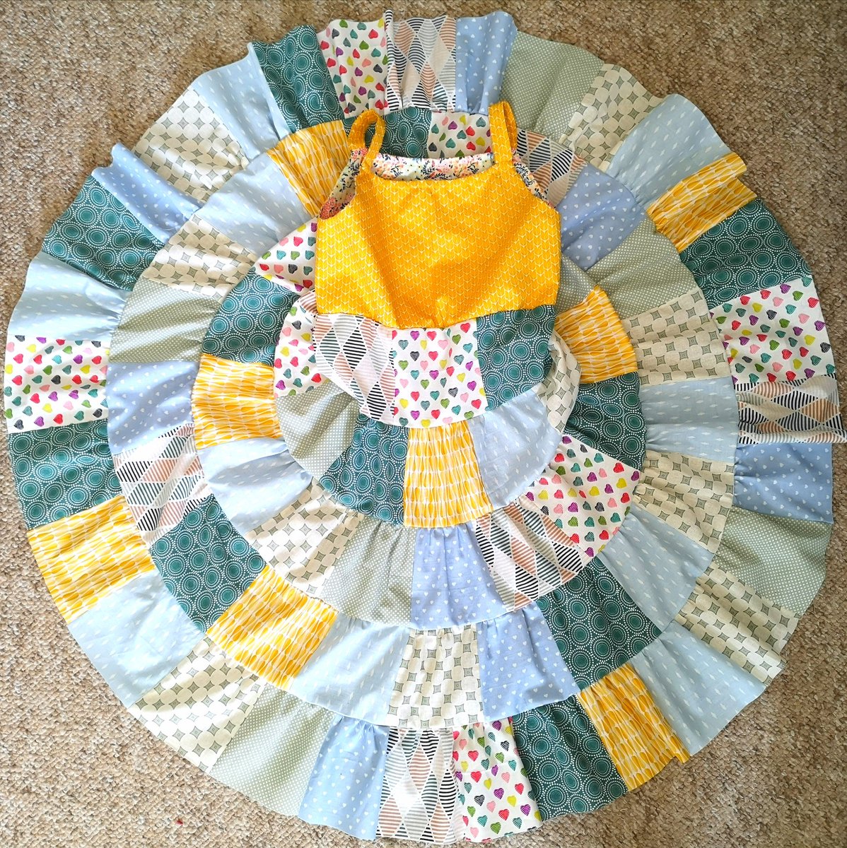 sticks_n_string's tweet image. Thought I'd use some fat quarters to make some sunshine. Going by the twirling I think the miss is pleased!