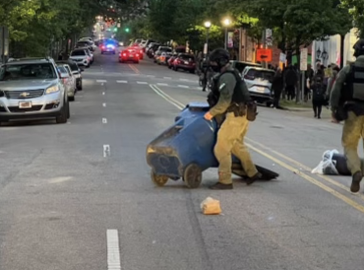 raleighpolice's tweet photo. The protest has been declared an unlawful assembly due to members of the crowd impeding the flow of traffic by tossing trash cans into the street. #RaleighProtest https://t.co/E4KduPPjIX