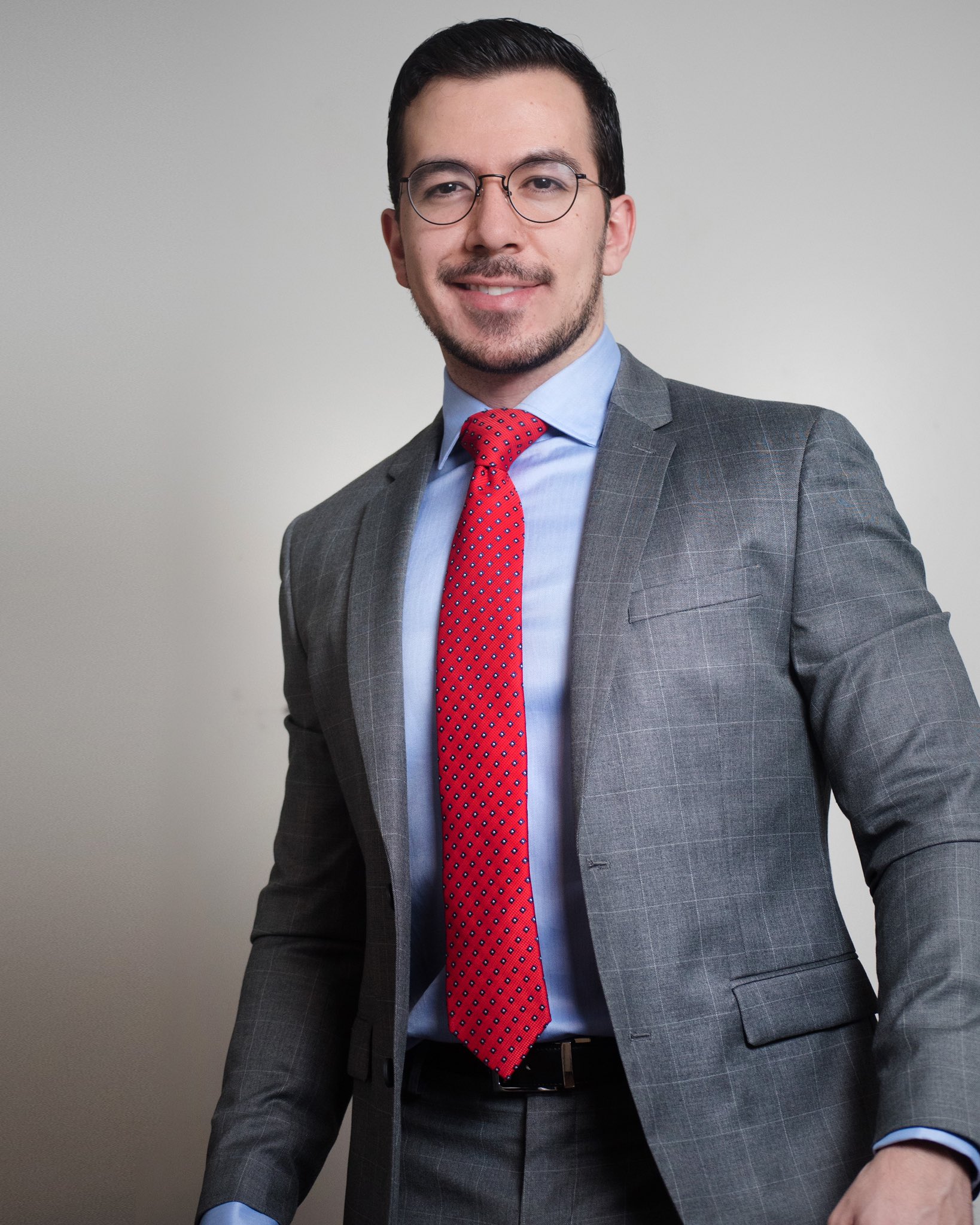 grey suit blue shirt red tie