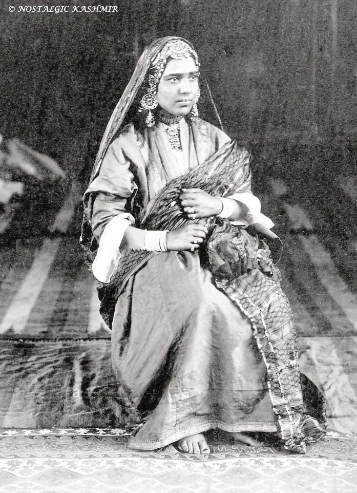 Photograph taken by John Burke & William Baker in 1869 of a prominent hafiza named Azee after performing in all her best finery. (P4)