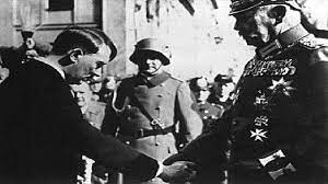 Hitler came to power in Germany in 1933, almost immediately denounced the Treaty of Versailles, which had ended WWI, and directed the nation to begin rearming. By 1936, the Germans had reclaimed the demilitarized zone in the Rhineland.