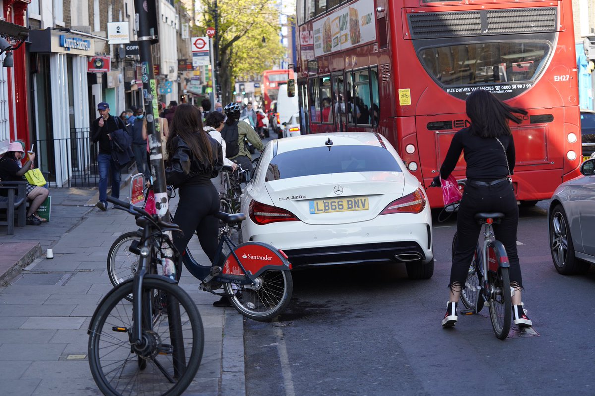 When a group of four young women on bikes try to get past.... the  @MercedesBenz is blocking their path. 4/7