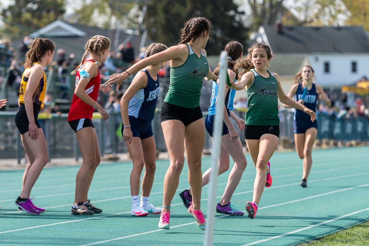 russellgifford's tweet photo. Medina's @mia_heine hands the baton to older sister @elly_heine at the @CometRelays this morning. Of course that nice pole had to be in the way ... @medhsgirlstrack https://t.co/Z2Y0iRJOvW