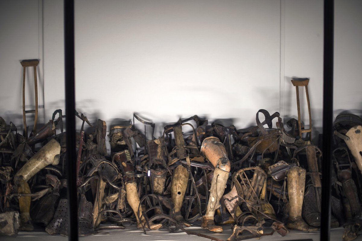 These are harrowing photos from the Auschwitz museum.They are shoes from the inmates and resources the disabled would have needed. They were forcefully taken off them during the period of entering the camp.Stop and look at one item one by one, that is somebody who died.